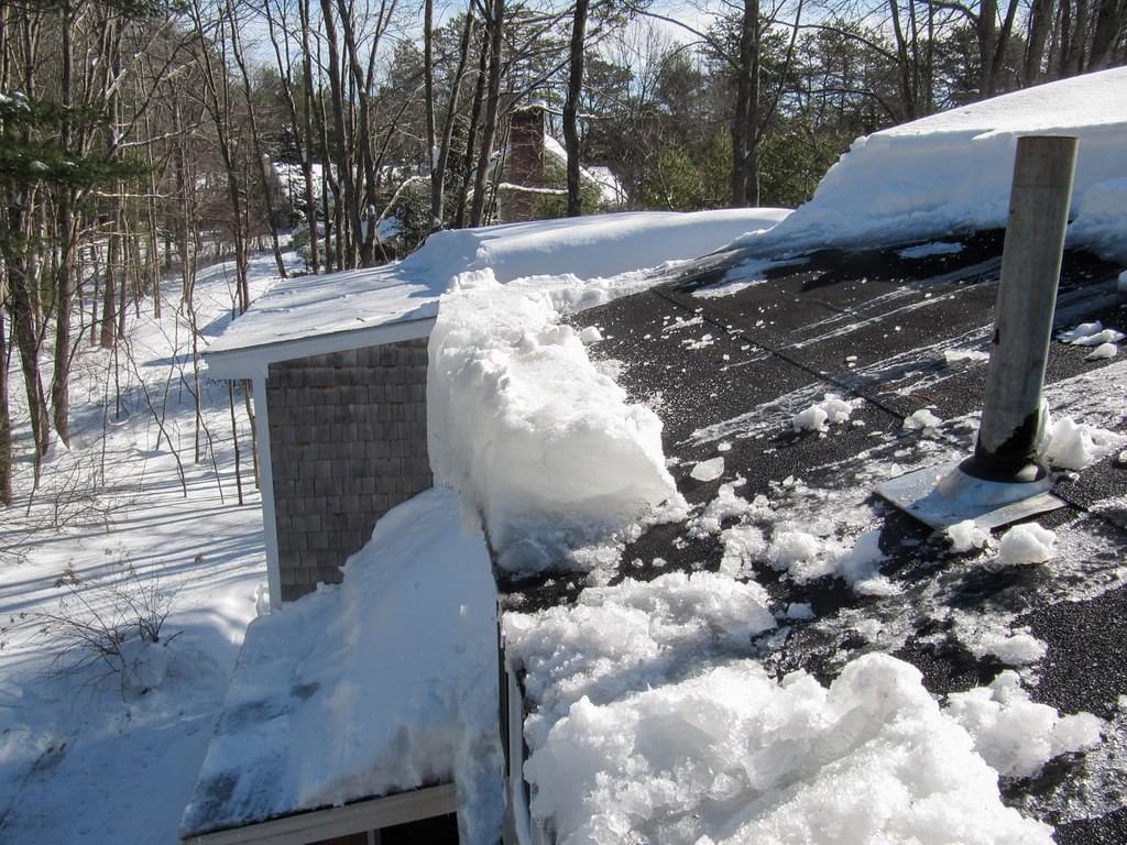 Ice build-up on a roof due to poor roof ventilation