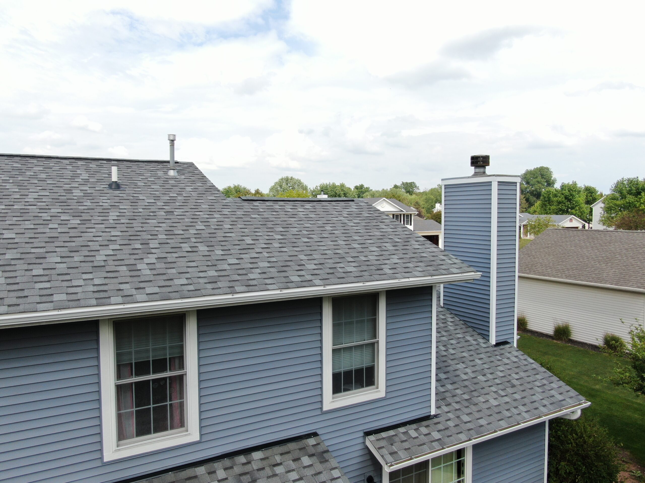 Newly installed dusty blue Norandex siding on a Wisconsin home.