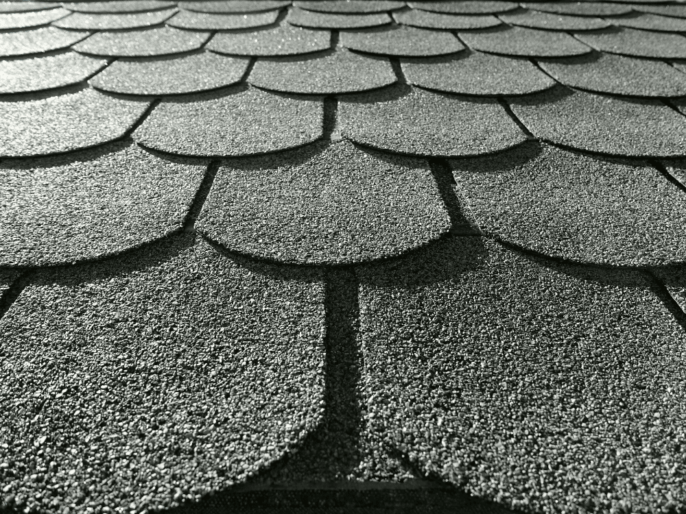 Close-up of dark grey luxury asphalt shingles.