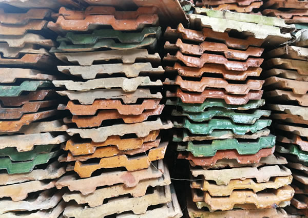 Piles of recycled roofing shingles.